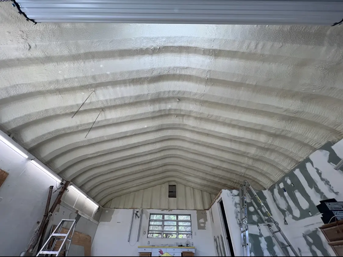 Spray polyurethane foam applied to the underside of a metal roof deck in New Ipswich